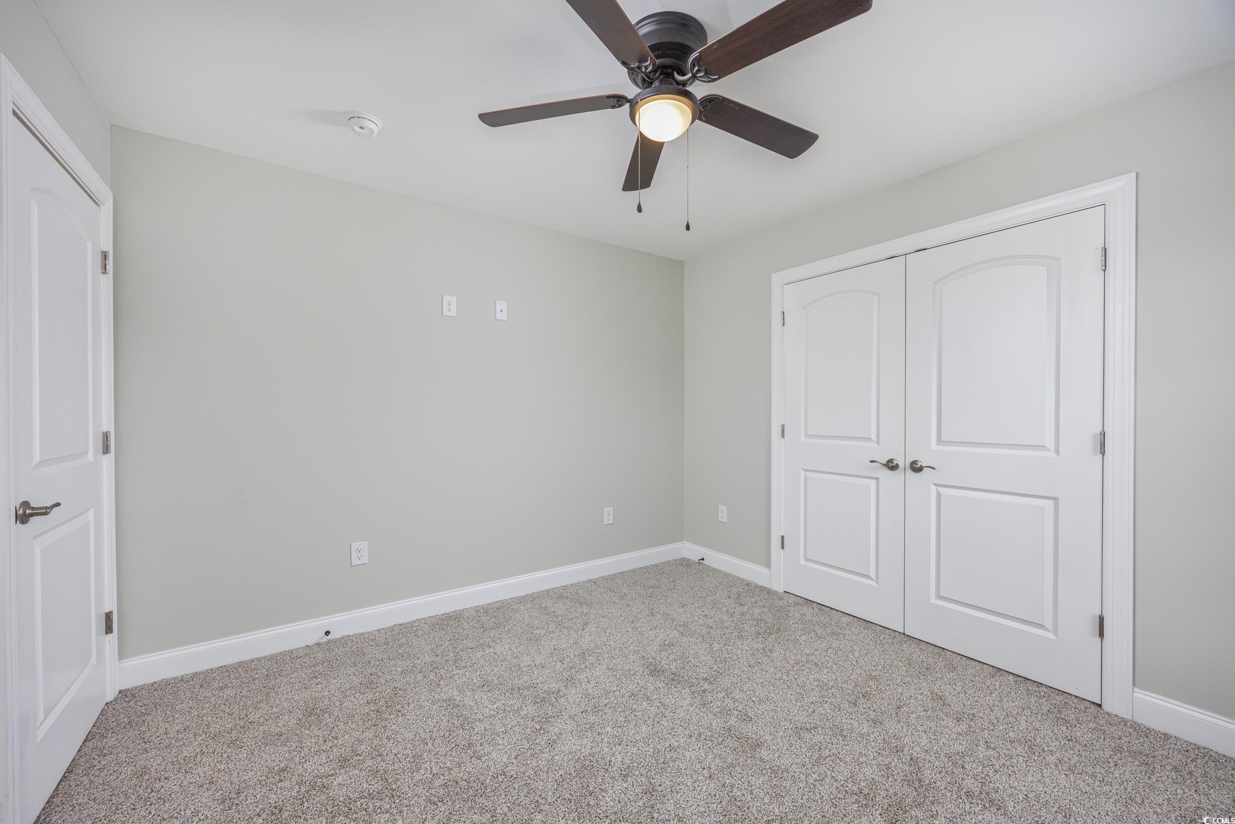2900 Cherry Hill Road Loris, SC 29569 - Photo 20 of 34 Unfurnished bedroom with a ceiling fan, carpet, a