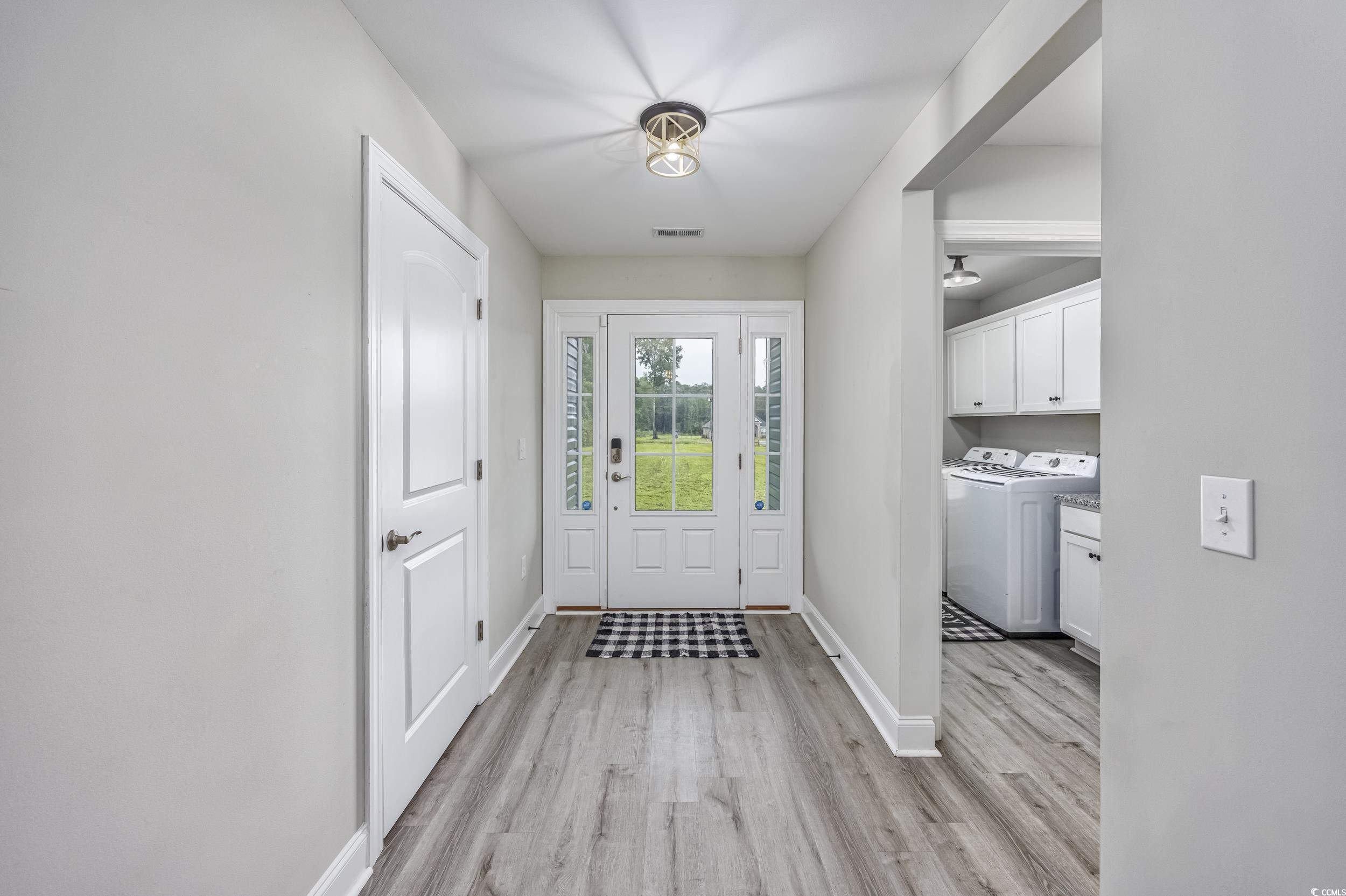 2900 Cherry Hill Road Loris, SC 29569 - Photo 2 of 34 Doorway featuring washer and dryer, baseboards, vi