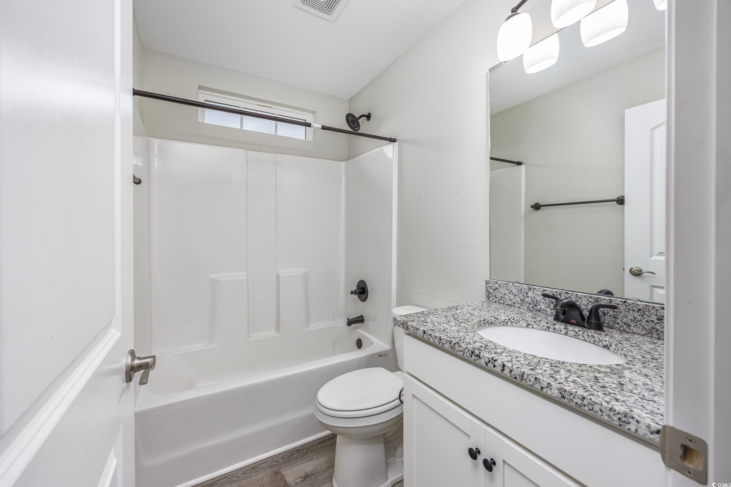 2900 Cherry Hill Road Loris, SC 29569 - Photo 21 of 34 Full bath featuring toilet, wood finished floors,