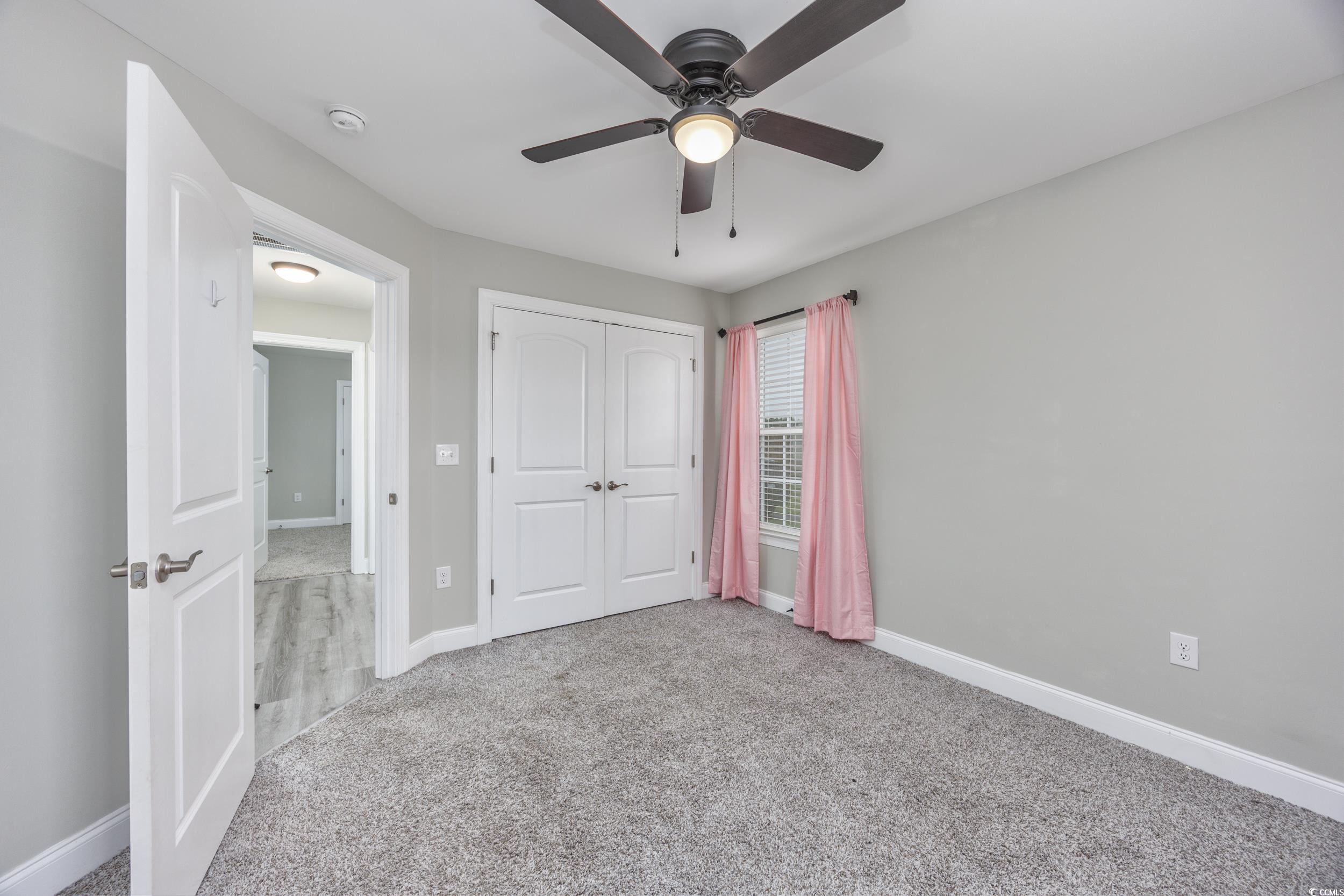 2900 Cherry Hill Road Loris, SC 29569 - Photo 22 of 34 Unfurnished bedroom featuring ceiling fan, carpet
