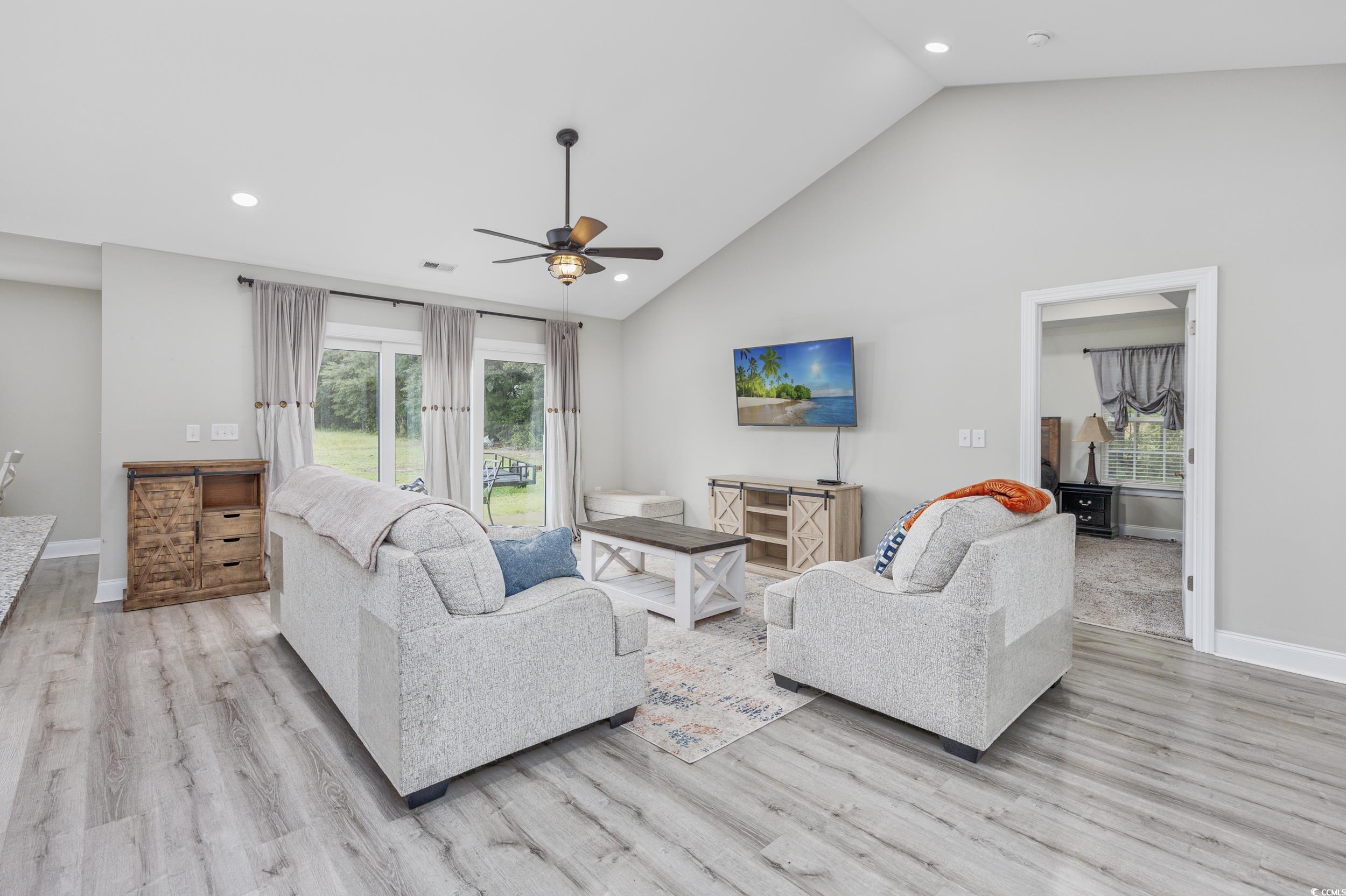 2900 Cherry Hill Road Loris, SC 29569 - Photo 3 of 34 Living area with baseboards, high vaulted ceiling,