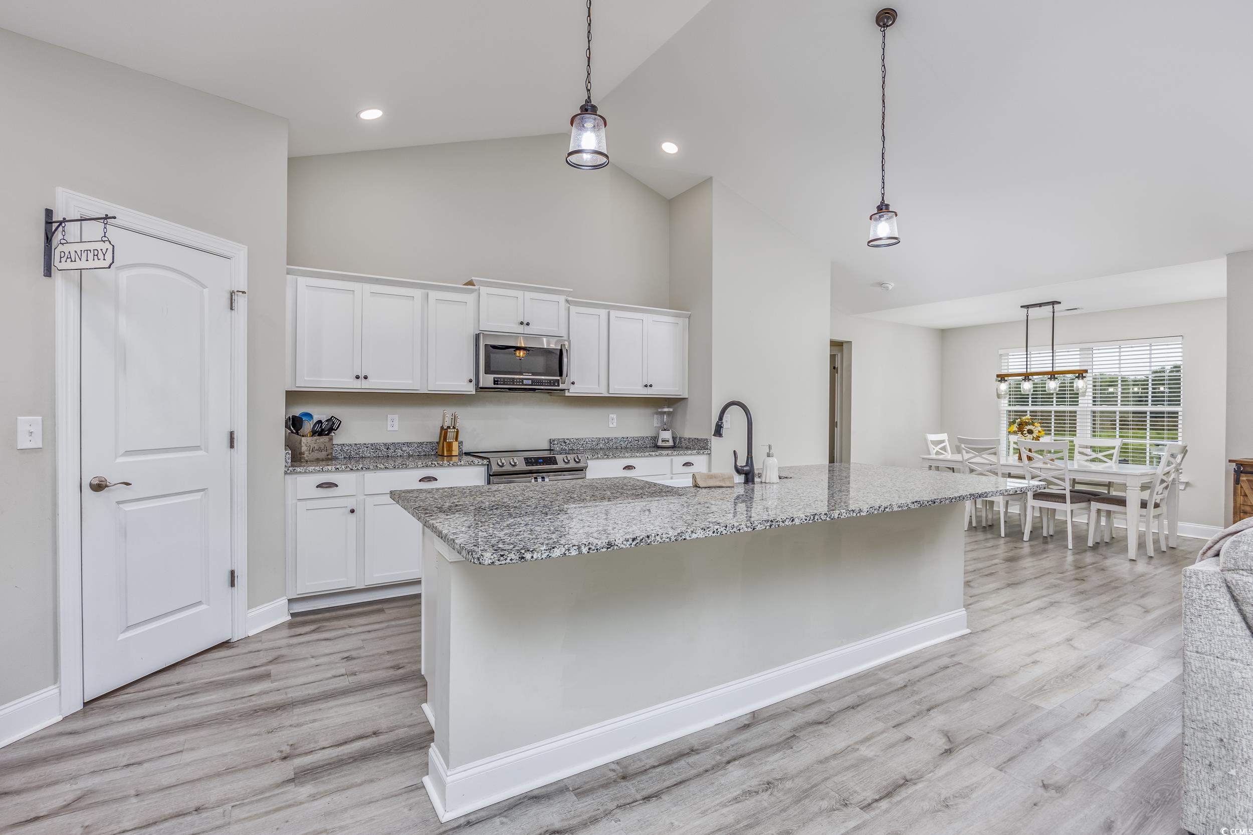 2900 Cherry Hill Road Loris, SC 29569 - Photo 6 of 34 Kitchen with light stone counters, stainless steel
