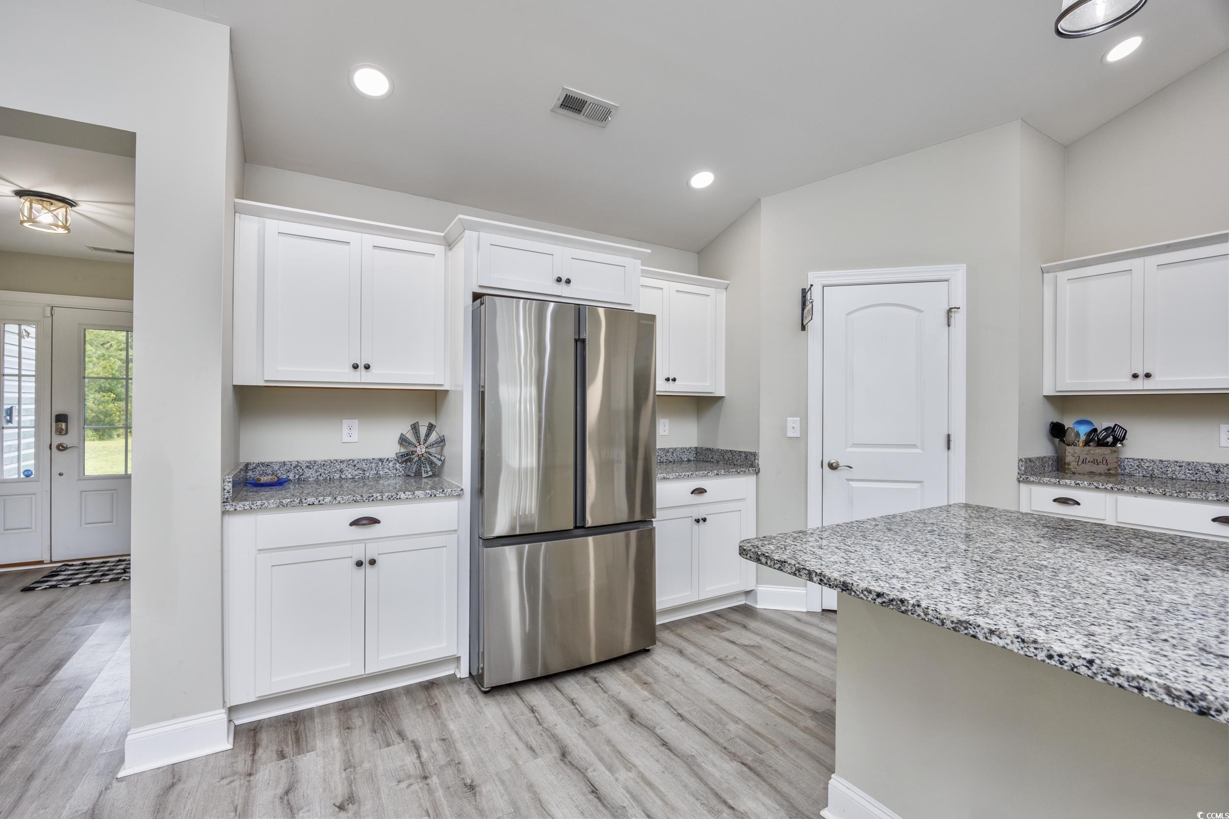 2900 Cherry Hill Road Loris, SC 29569 - Photo 7 of 34 Kitchen featuring light wood finished floors, loft