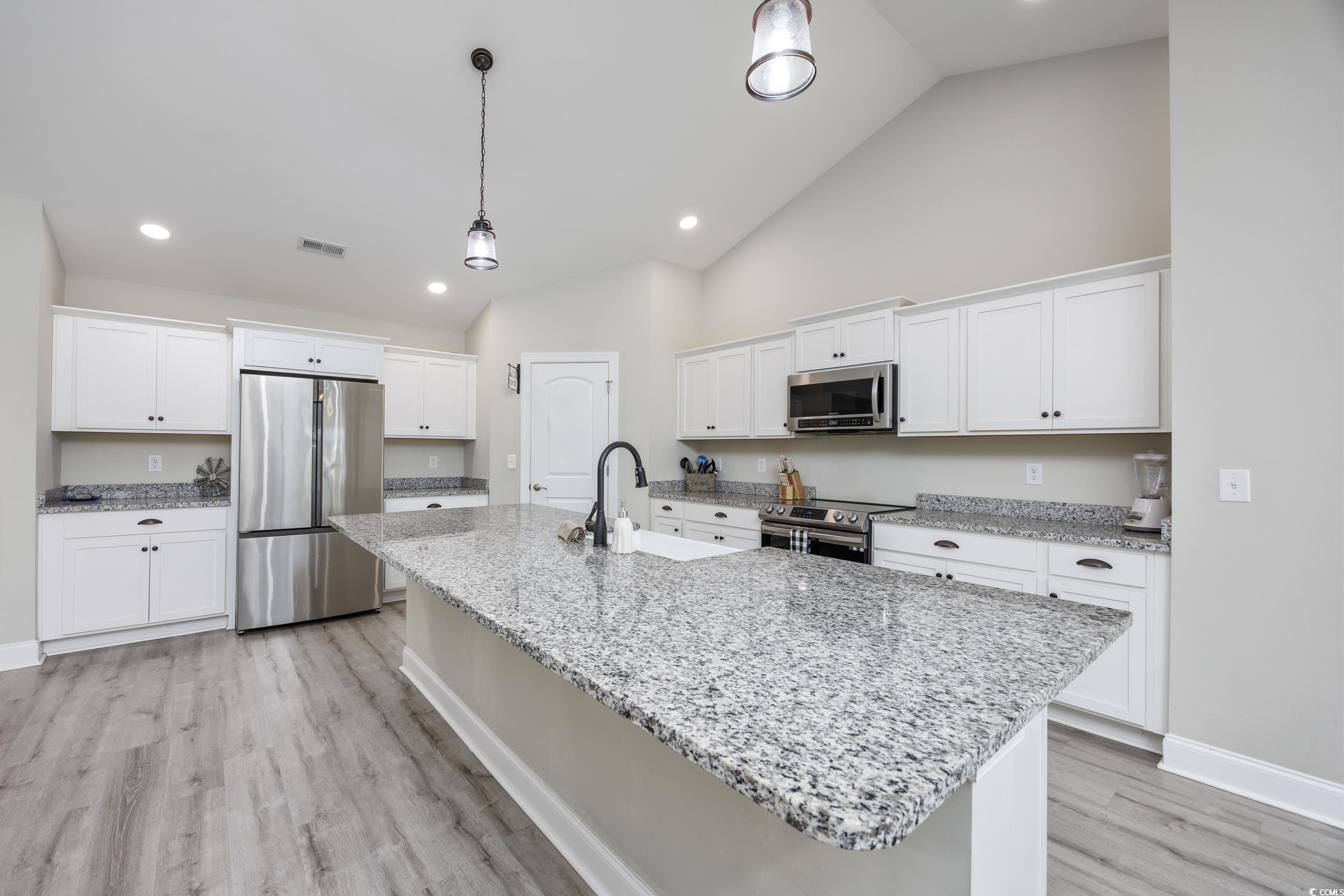 2900 Cherry Hill Road Loris, SC 29569 - Photo 8 of 34 Kitchen with light wood finished floors, an island