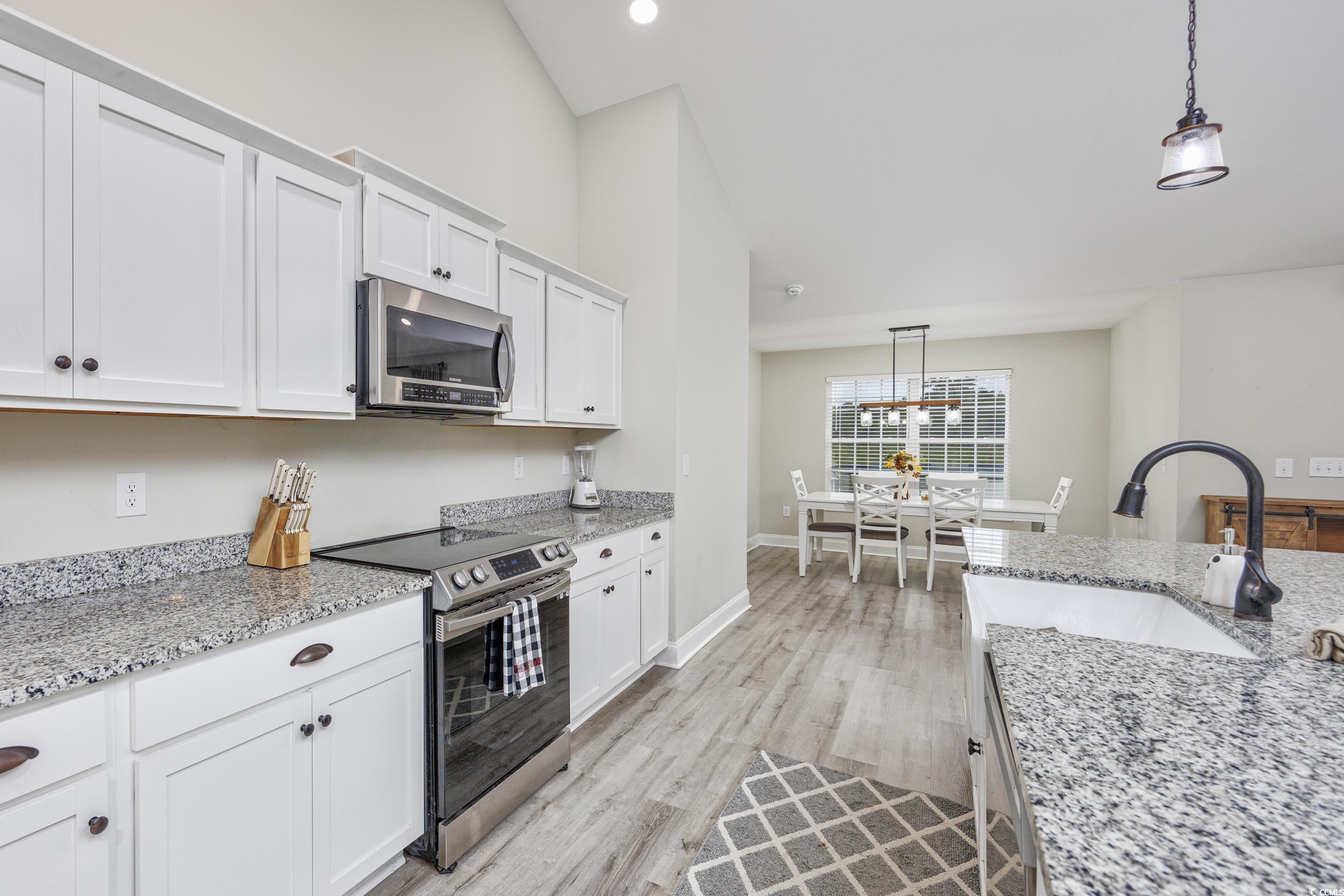 2900 Cherry Hill Road Loris, SC 29569 - Photo 10 of 34 Kitchen with light wood finished floors, hanging l