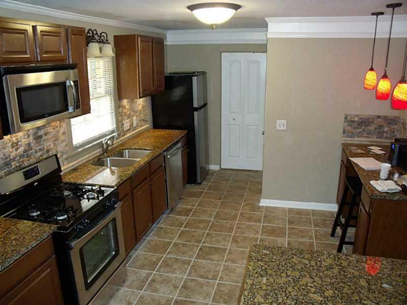 1055 Grimes Bridge Road Roswell, GA 30075 - Photo 1 of 1 Kitchen. All-new kitchen has granite, cherry cabinets, stone back splash and stainless appliances