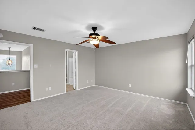 a large kitchen with cabinets and furniture