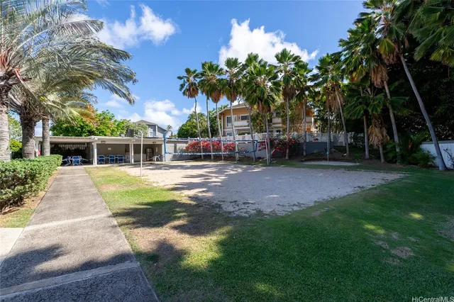 a living room with furniture a rug and a table