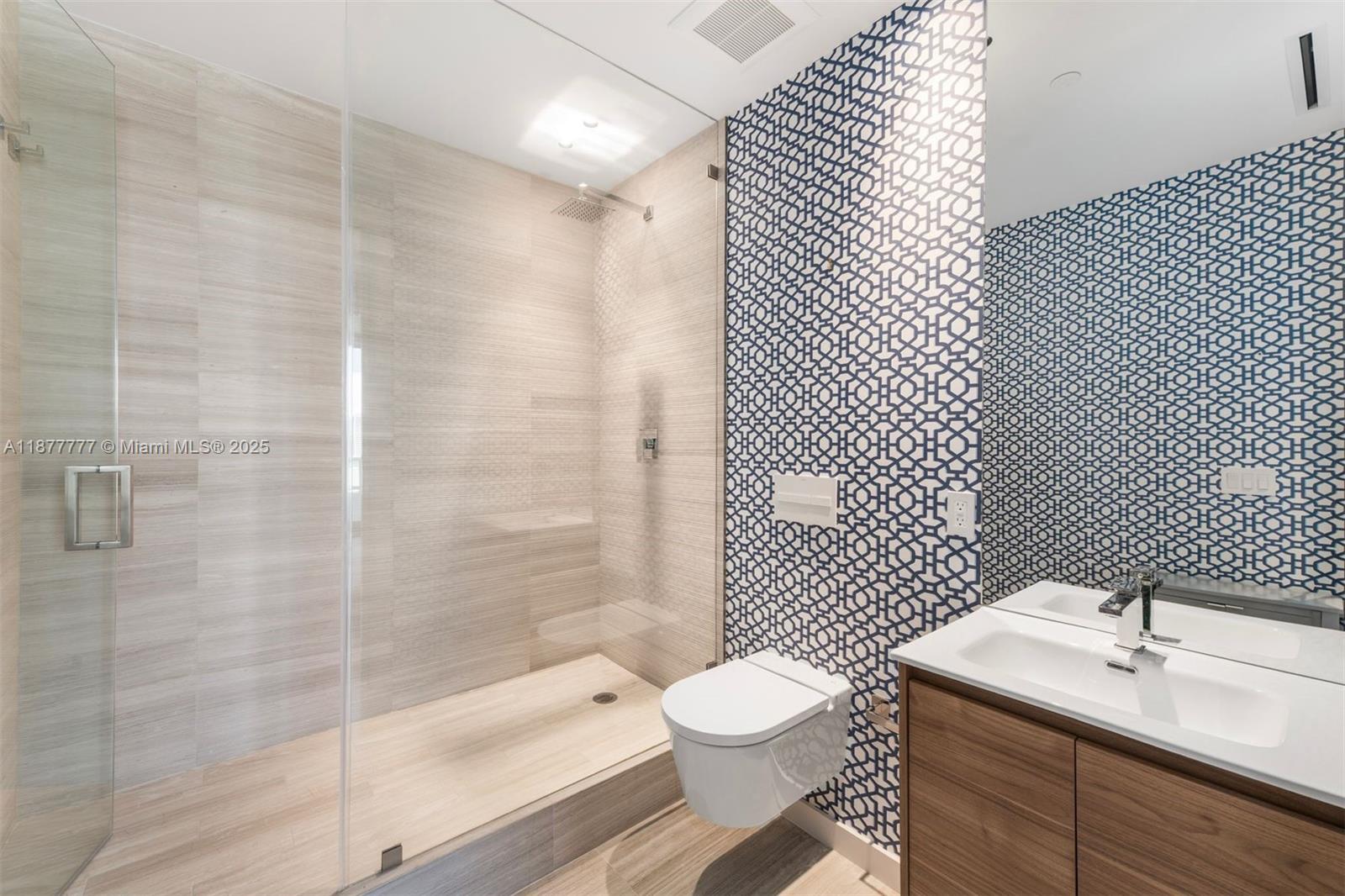 4701 Meridian Avenue, Unit 512 Miami Beach, FL 33140 - Photo 16 of 60 a bathroom with a sink toilet and shower