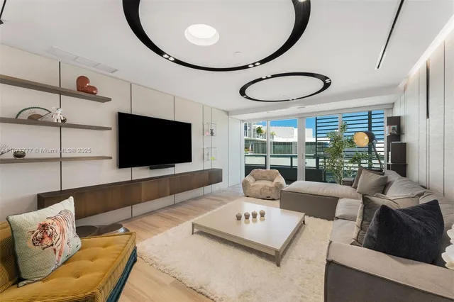 a living room with furniture and a table