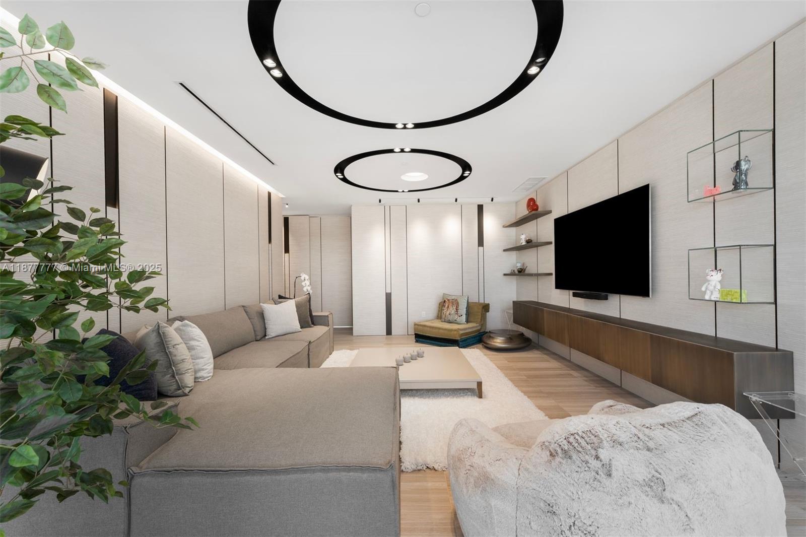 4701 Meridian Avenue, Unit 512 Miami Beach, FL 33140 - Photo 20 of 60 a bedroom with a bed and a flat screen tv