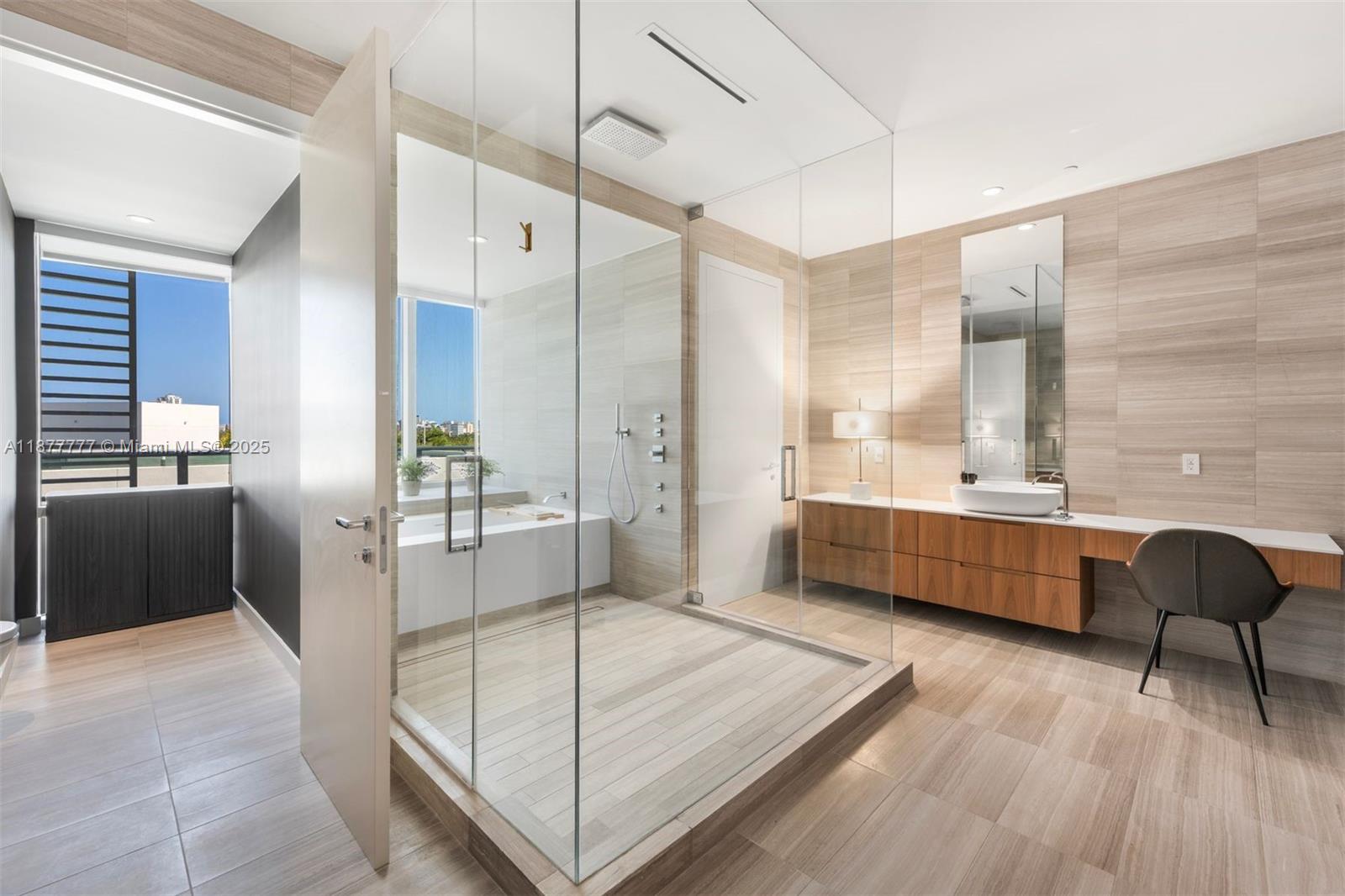 4701 Meridian Avenue, Unit 512 Miami Beach, FL 33140 - Photo 27 of 60 a bathroom with a tub sink and mirror
