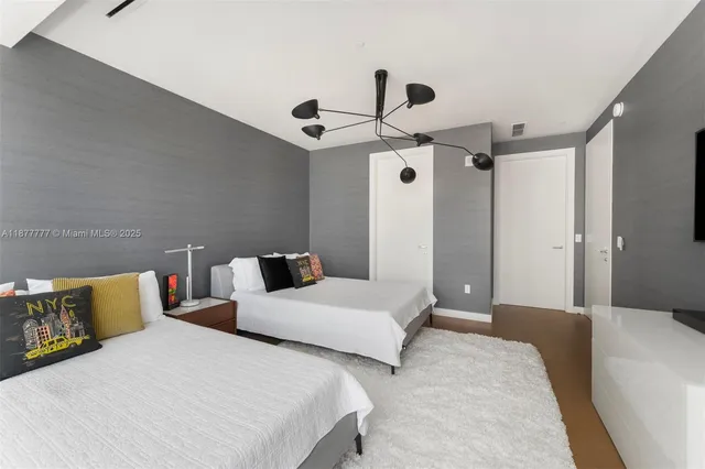 a view of a balcony with two chairs and a table