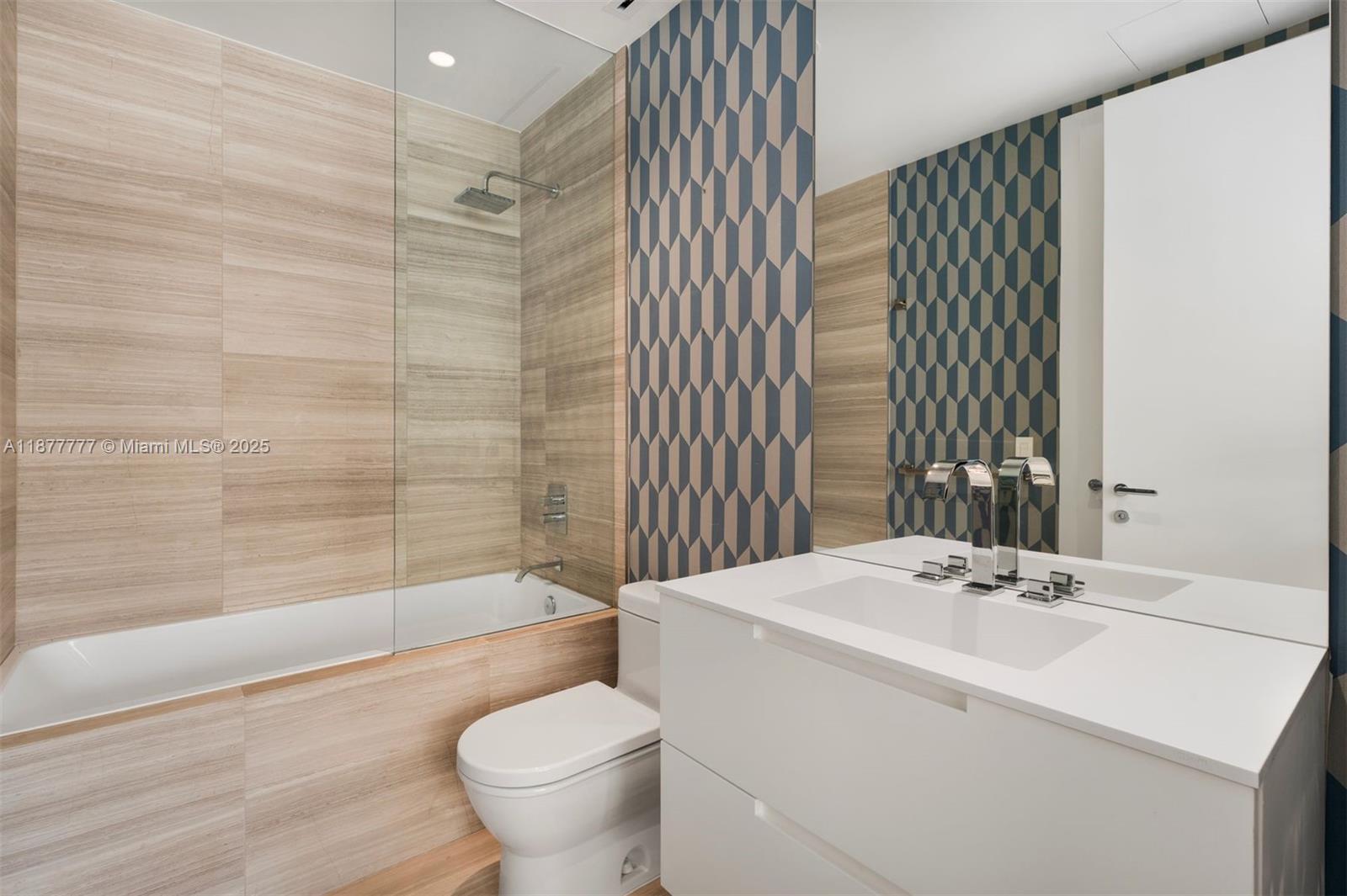 4701 Meridian Avenue, Unit 512 Miami Beach, FL 33140 - Photo 30 of 60 a bathroom with a sink toilet and shower