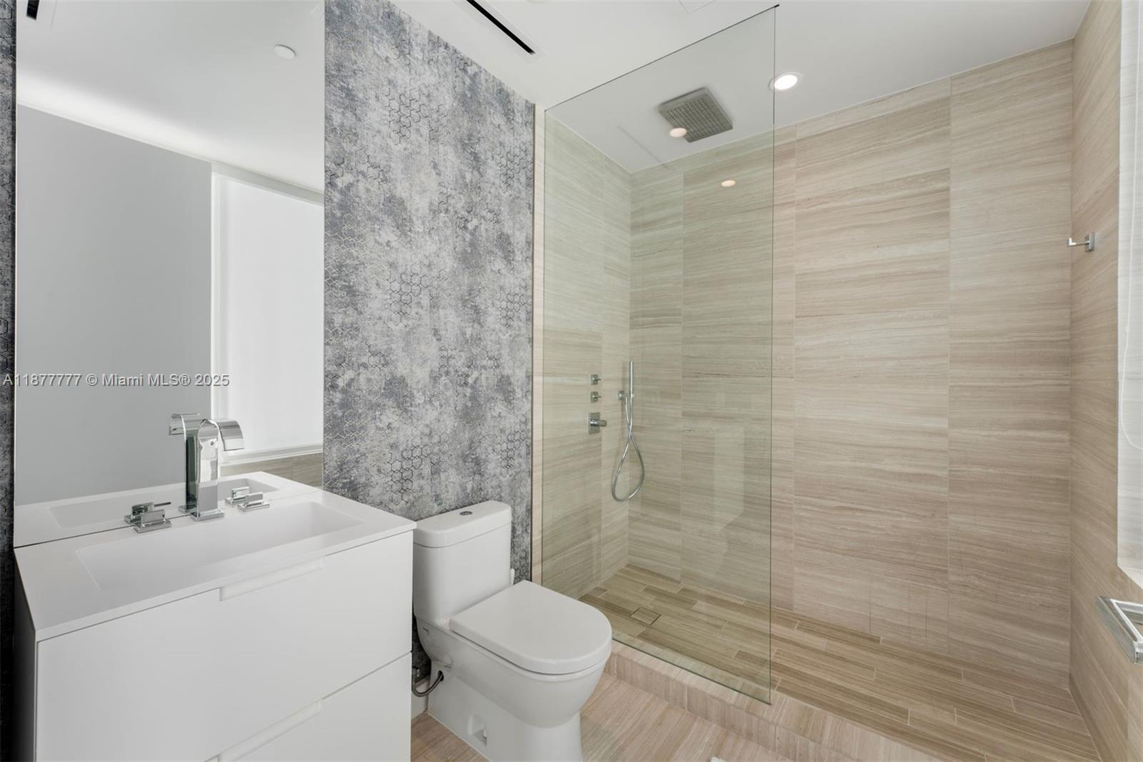 4701 Meridian Avenue, Unit 512 Miami Beach, FL 33140 - Photo 31 of 60 a bathroom with a sink a toilet and shower