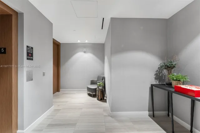 a kitchen with kitchen island granite countertop a sink stove and wooden cabinets