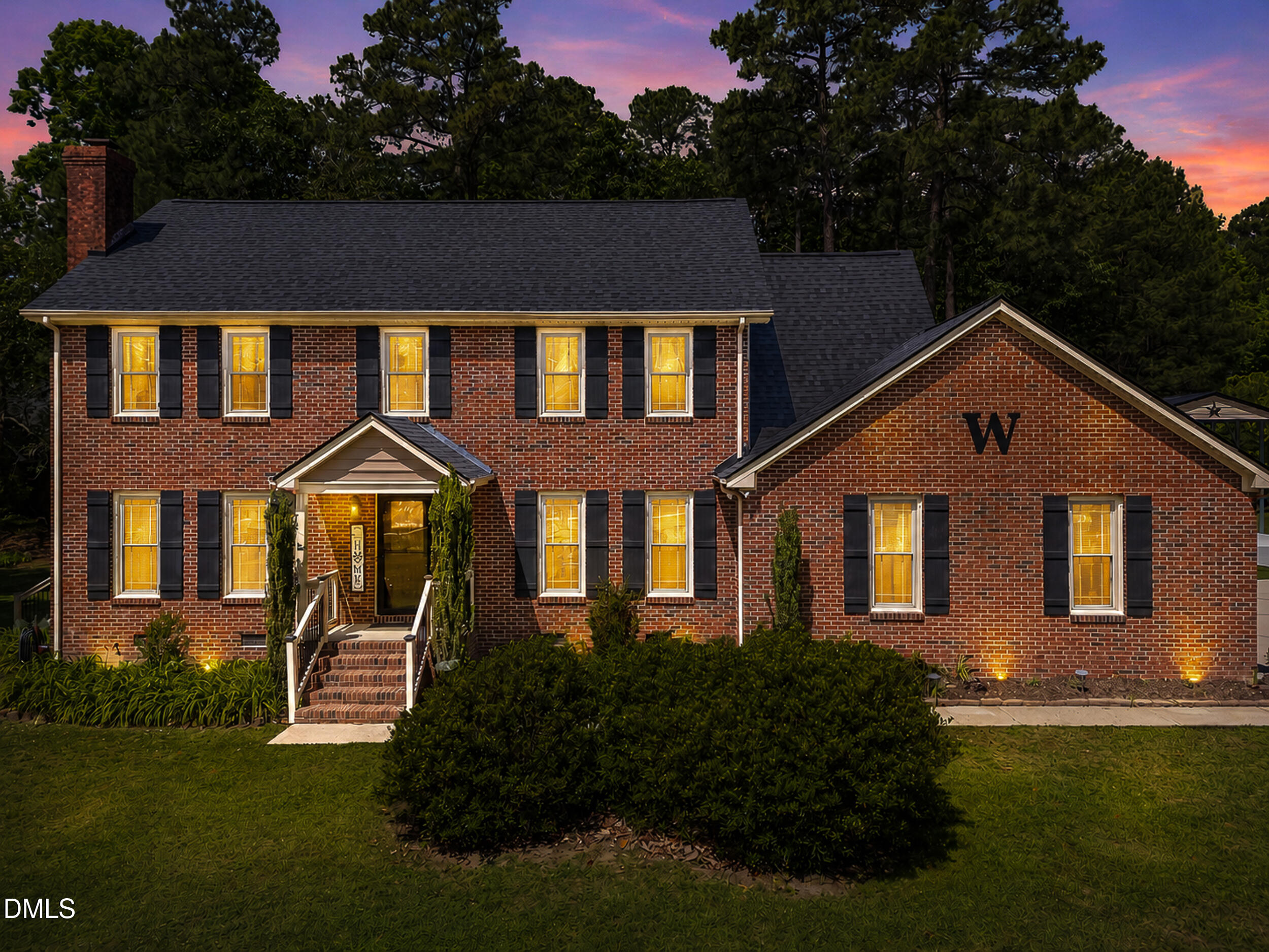 4209 Lassiter Road Wake Forest, NC 27587 - Photo 20 of 39 a front view of a house with a yard