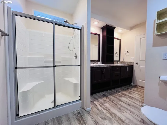 a bathroom with a sink toilet and shower
