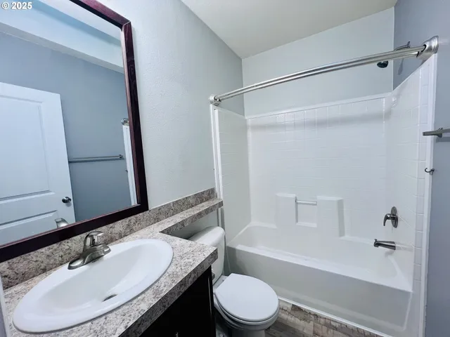 a view of a kitchen from the hallway