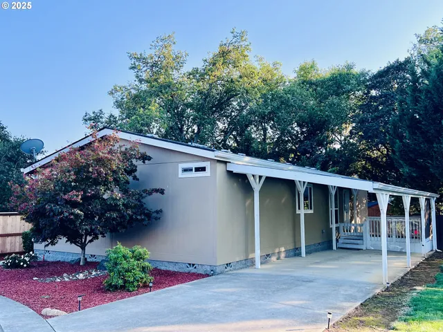 a house with a tree in front of it