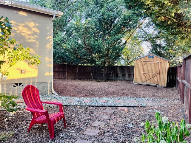 a view of house with wooden floor and wooden fence