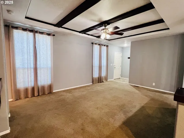 a kitchen with stainless steel appliances a refrigerator stove and microwave