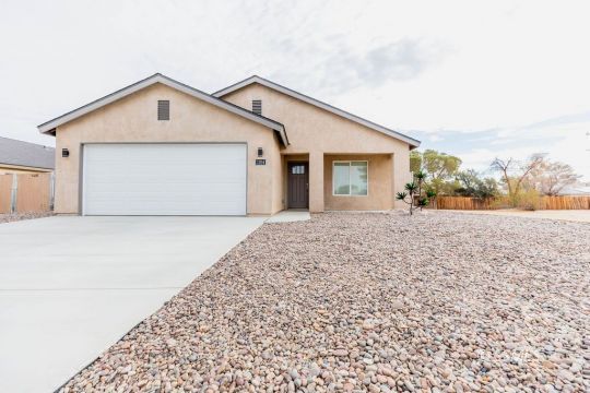 1204 South McCall Street Ridgecrest, CA 93555 - Photo 1 of 27 a front view of a house with a yard