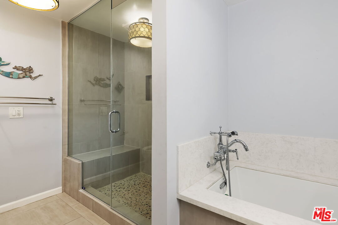 4150 Vía Dolce, Unit 236 Venice, CA 90292 - Photo 17 of 26 a bathroom with a bathtub and a shower