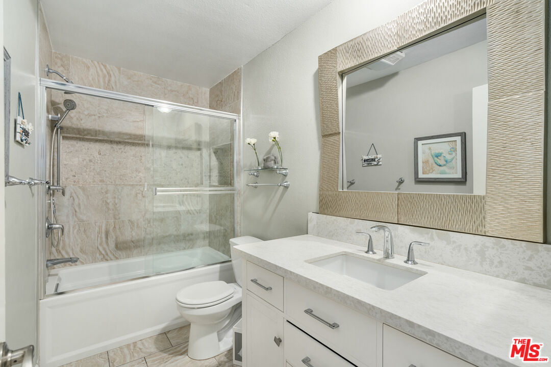 4150 Vía Dolce, Unit 236 Venice, CA 90292 - Photo 20 of 26 a bathroom with a sink toilet and shower