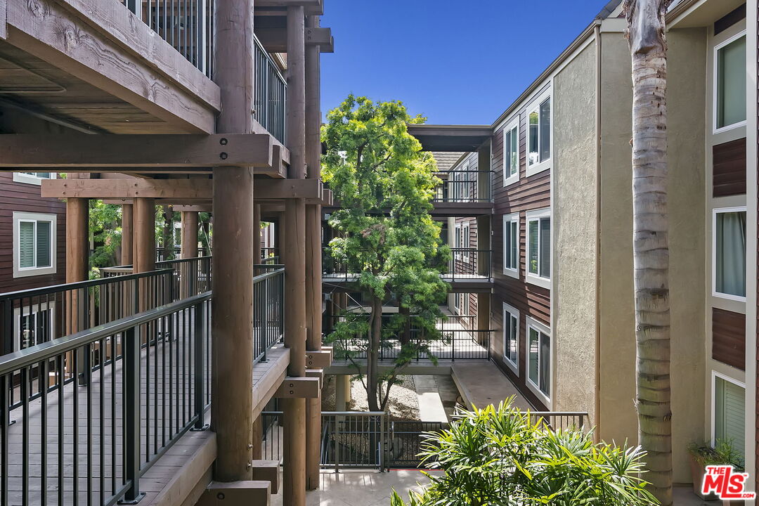 4150 Vía Dolce, Unit 236 Venice, CA 90292 - Photo 2 of 26 a view of a porch with a bench