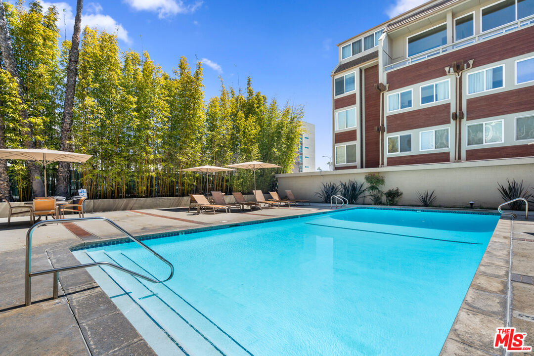 4150 Vía Dolce, Unit 236 Venice, CA 90292 - Photo 22 of 26 a view of a house with swimming pool and sitting area