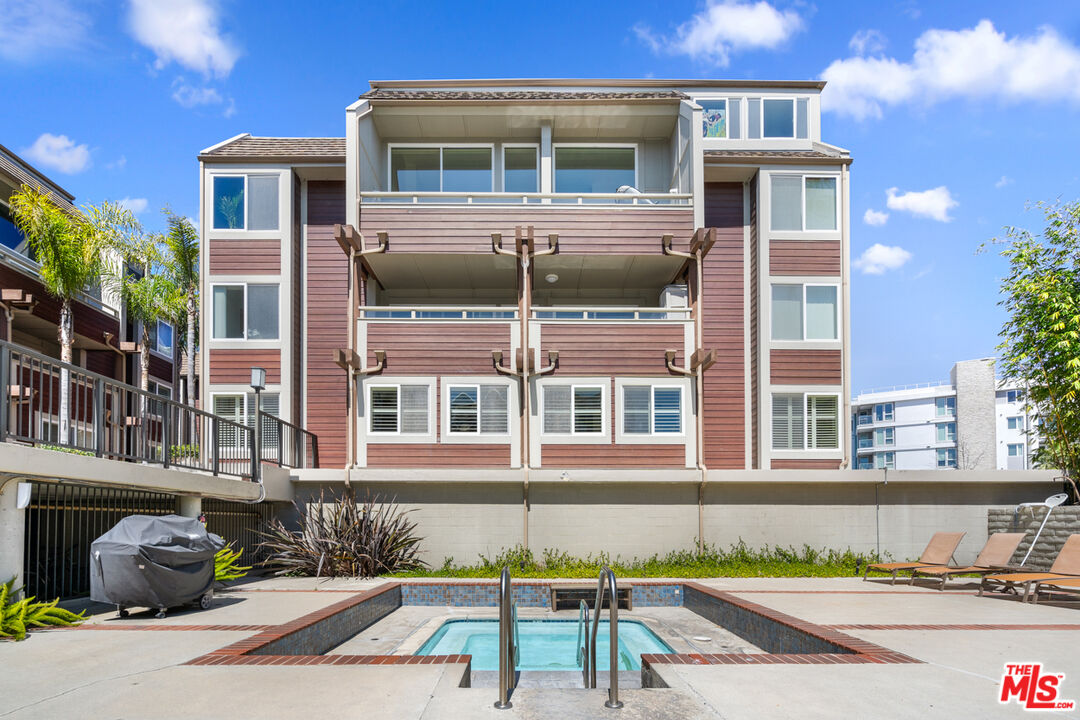 4150 Vía Dolce, Unit 236 Venice, CA 90292 - Photo 23 of 26 a front view of a house with a swimming pool