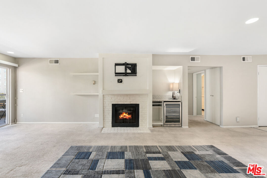 4150 Vía Dolce, Unit 236 Venice, CA 90292 - Photo 5 of 26 a view of a livingroom with a fireplace
