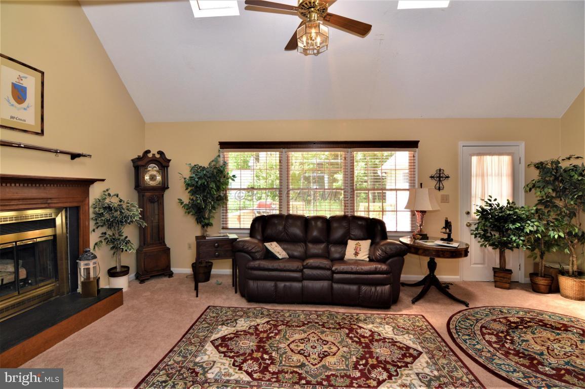 1 Mist Flower Road Ocean Pines, MD 21811 - Photo 8 of 66 a living room with furniture and a fireplace