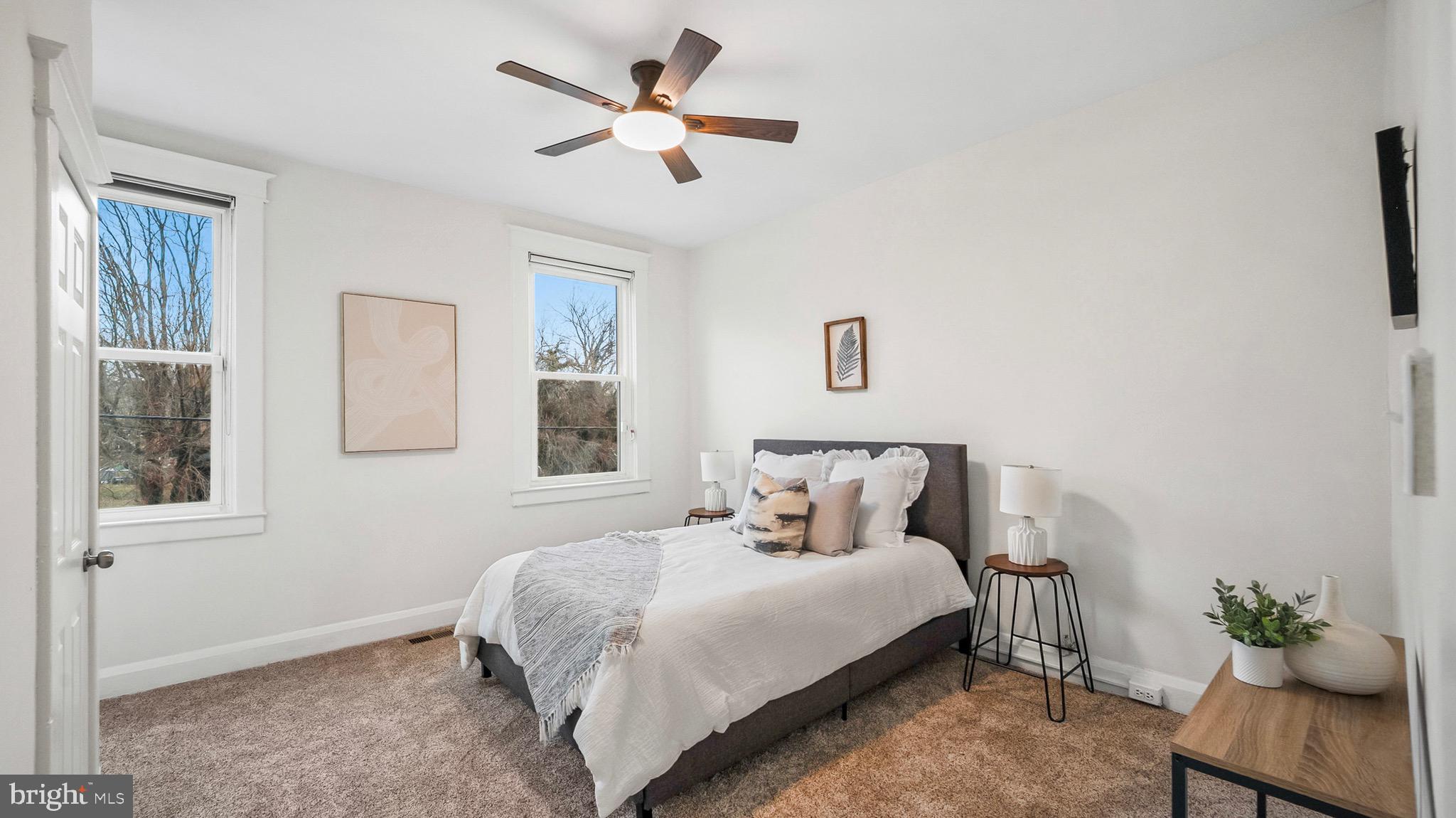 27 North Monastery Avenue Baltimore, MD 21229 - Photo 13 of 26 a bedroom with a bed chandelier and a window