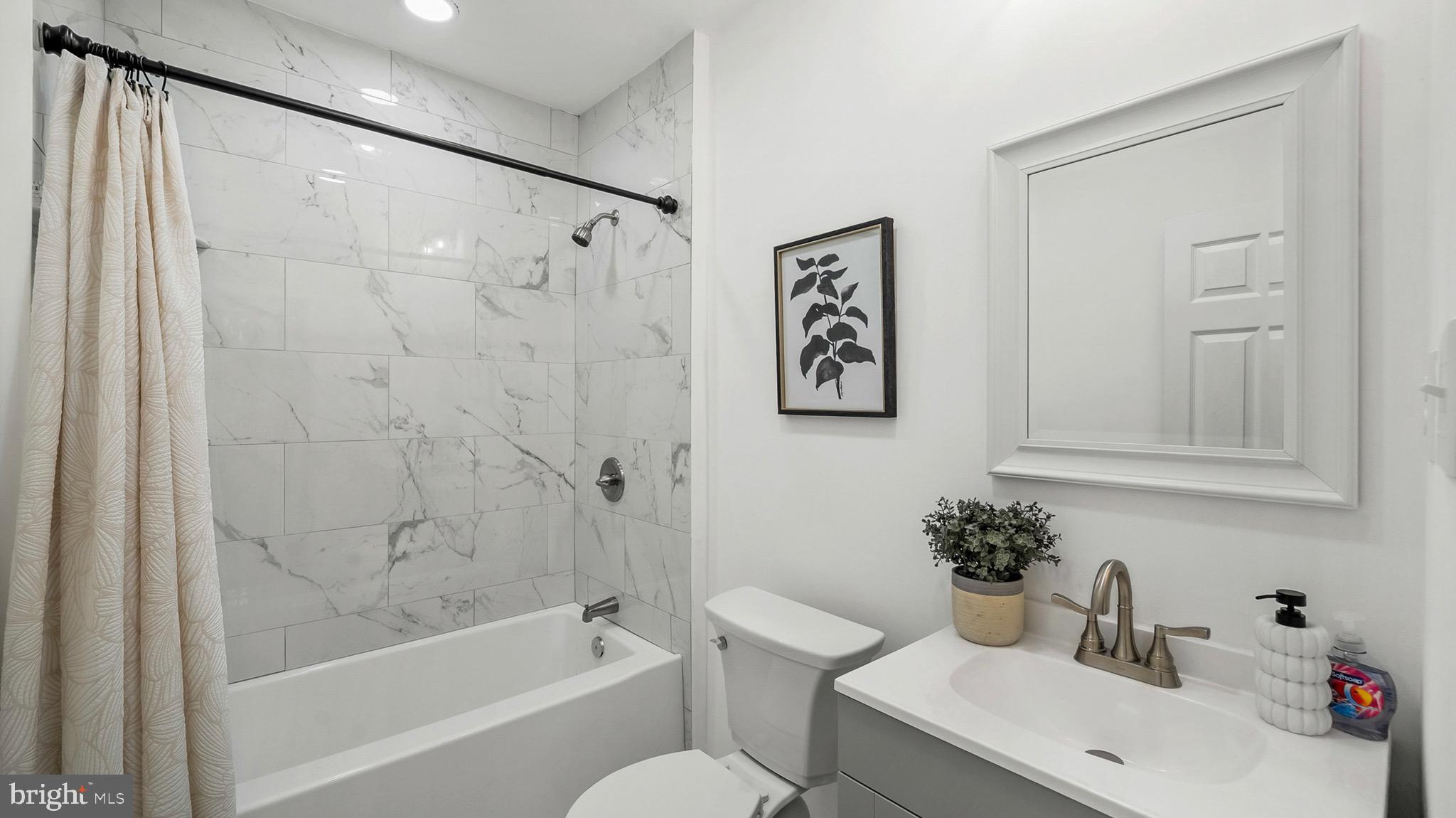 27 North Monastery Avenue Baltimore, MD 21229 - Photo 14 of 26 a bathroom with a sink toilet and shower