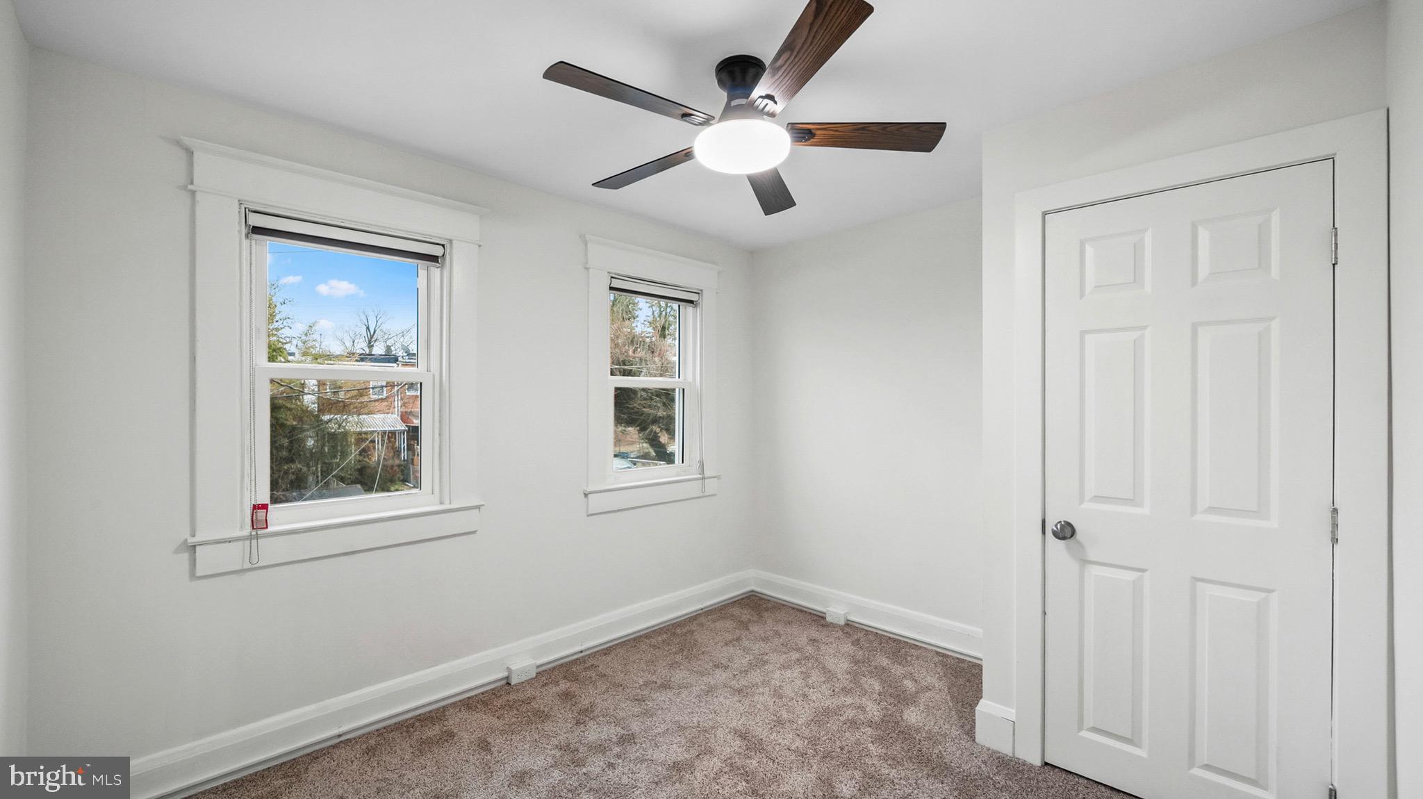 27 North Monastery Avenue Baltimore, MD 21229 - Photo 17 of 26 an empty room with windows and fan