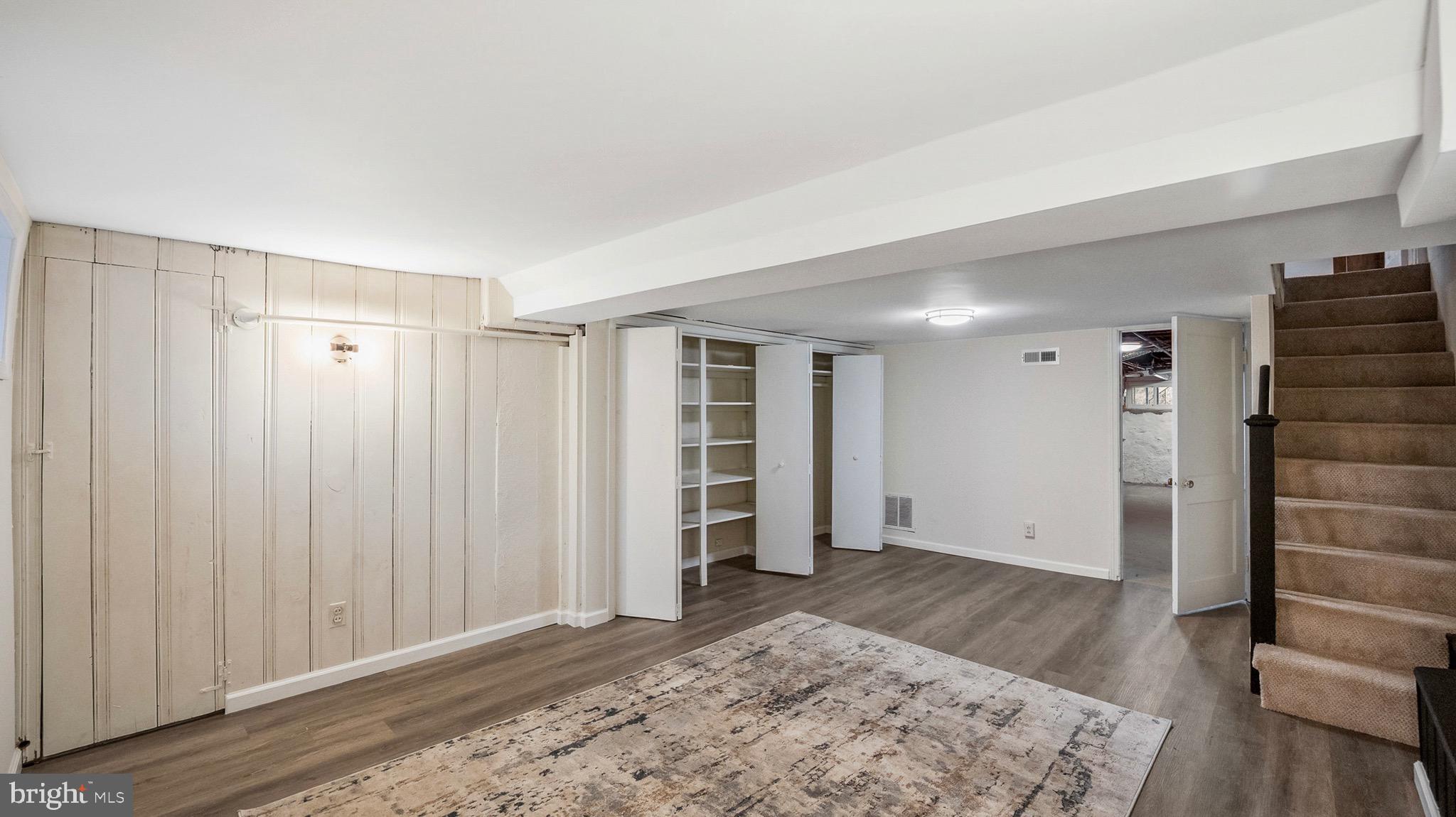 27 North Monastery Avenue Baltimore, MD 21229 - Photo 22 of 26 a view of livingroom with hardwood floor and hallway