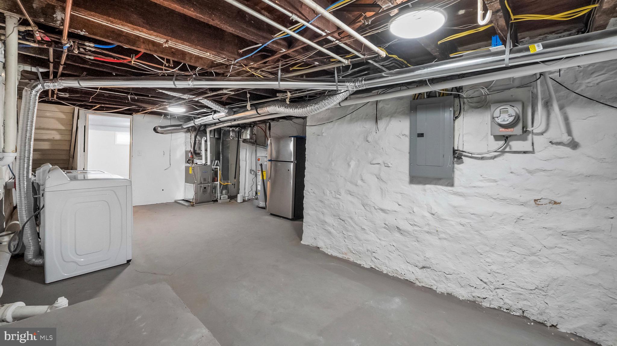 27 North Monastery Avenue Baltimore, MD 21229 - Photo 23 of 26 a view of water heater room with refrigerator