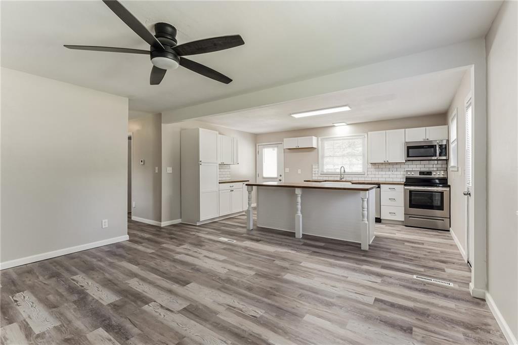 352 Walnut Hill Road Uniontown, PA 15401 - Photo 20 of 30 a view of kitchen with wooden floor and window