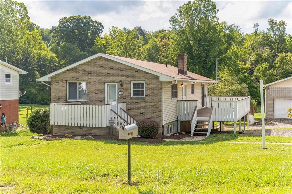 352 Walnut Hill Road Uniontown, PA 15401 - Photo 26 of 30 a front view of a house with swimming pool and porch