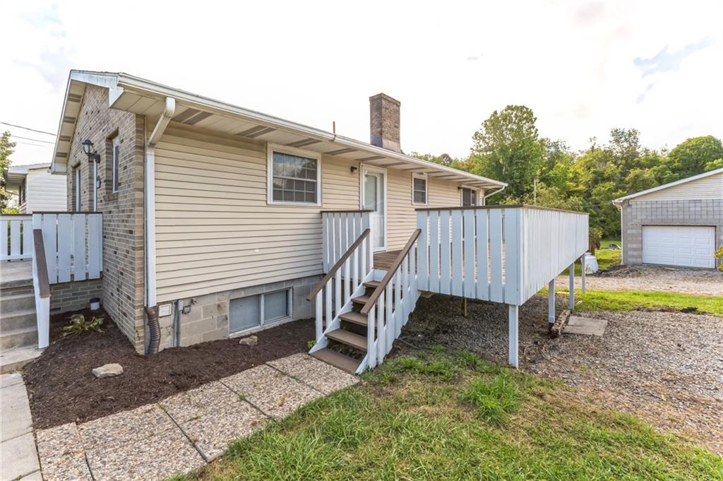 352 Walnut Hill Road Uniontown, PA 15401 - Photo 3 of 30 a view of a house with a yard and deck