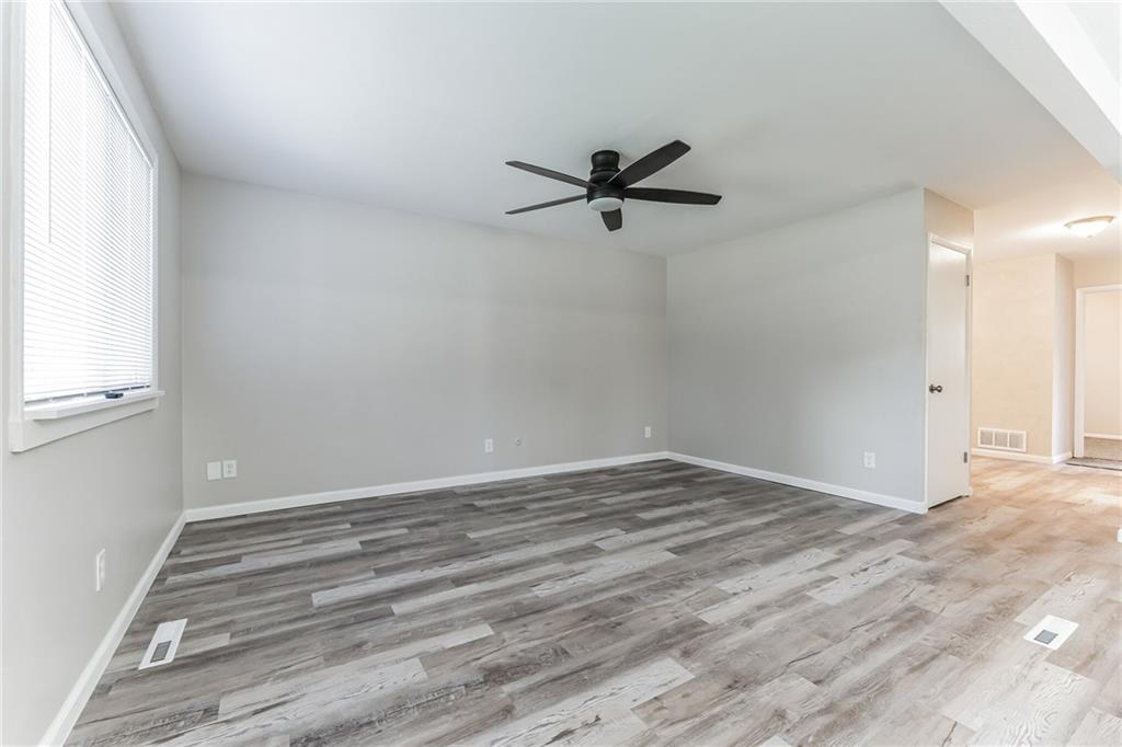 352 Walnut Hill Road Uniontown, PA 15401 - Photo 4 of 30 a view of a big room with wooden floor and windows