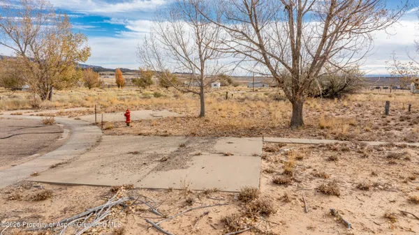 a view of snow on the side of road