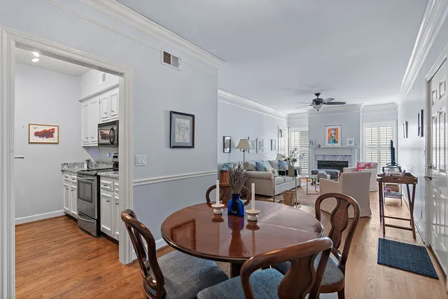 a view of a dining room with furniture and wooden floor