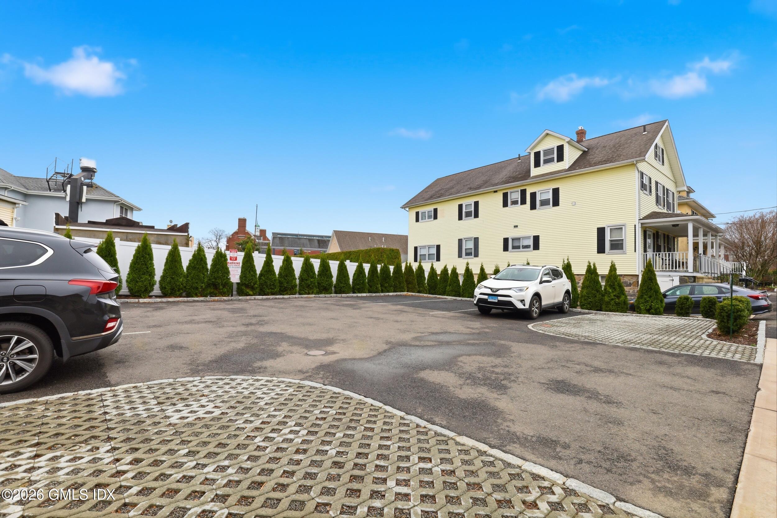 140 Hamilton Avenue, Unit 1 Greenwich, CT 06830 - Photo 13 of 14 a view of a white house with a street view