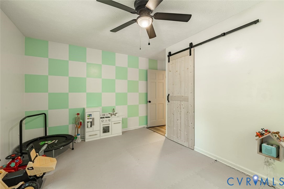12397 New Market Mill Road Beaverdam, VA 23015 - Photo 24 of 44 a view of a room with gym equipment