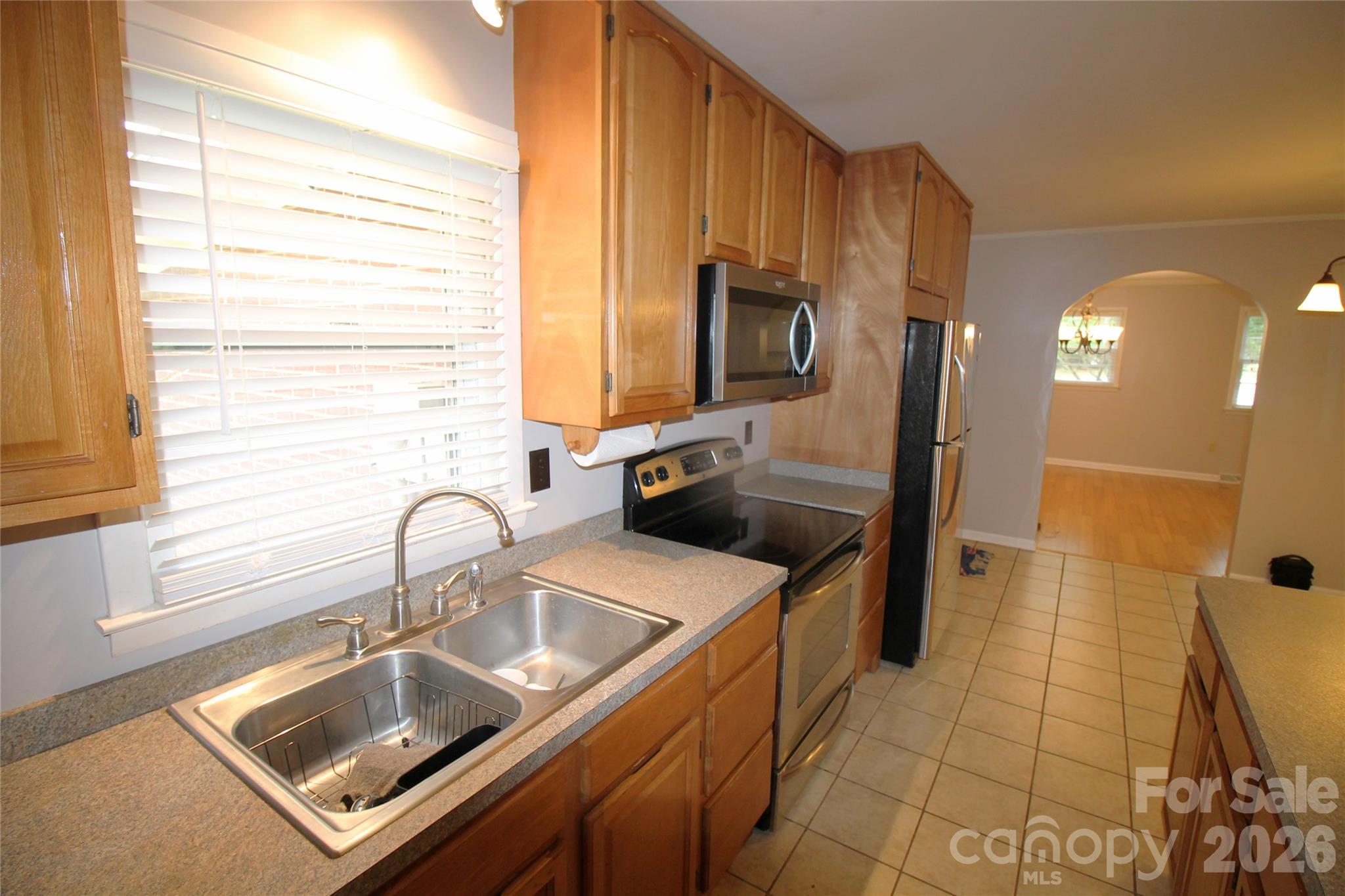 203 Ratchford Farm Road Gastonia, NC 28056 - Photo 8 of 38 a kitchen with a sink a stove and cabinets