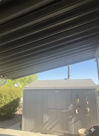 a view of a porch and a yard