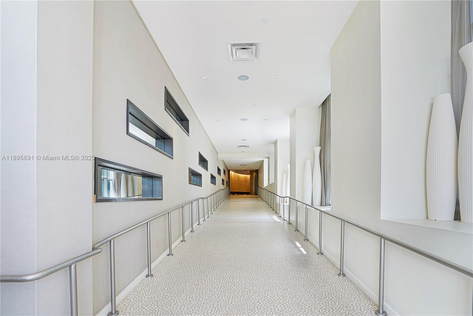 4401 Collins Avenue, Unit 2011 Miami Beach, FL 33140 - Photo 44 of 64 a view of staircase with lots of car parked
